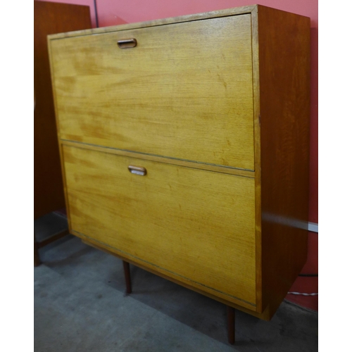 137 - A teak two door record cabinet