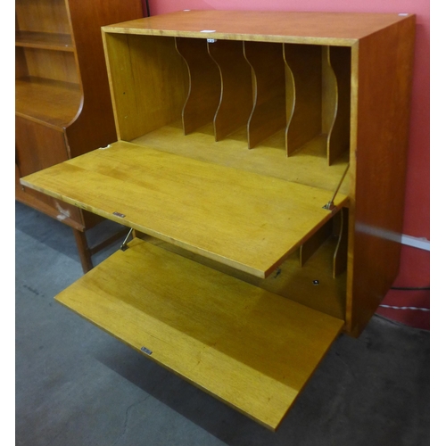 137 - A teak two door record cabinet