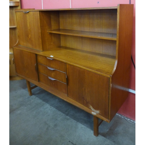 138 - A teak highboard