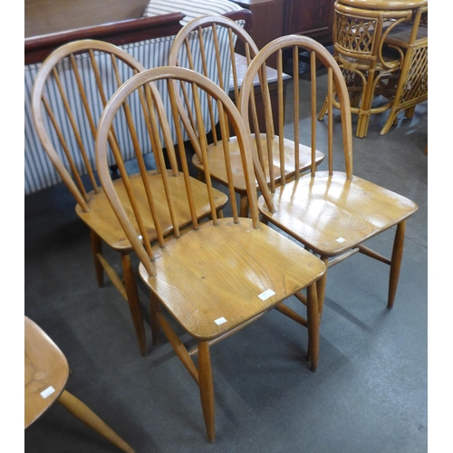 140 - A set of four Ercol Blonde elm and beech Windsor chairs