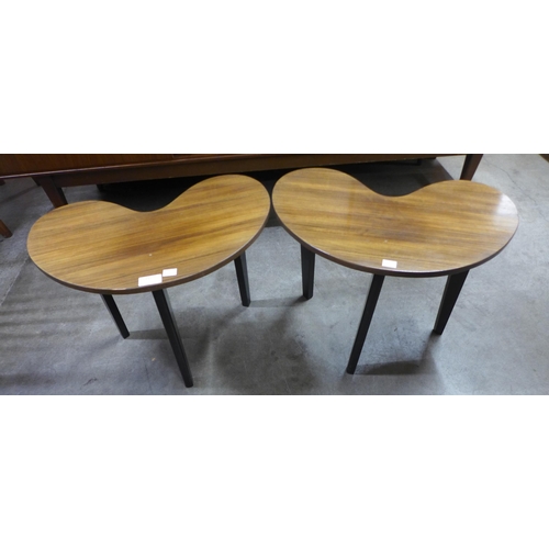 157 - A pair of tola wood and black kidney shaped lamp tables