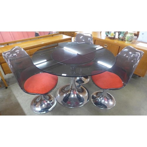 160 - A French Agier Cuivre circular glass and chrome tulip dining table and three chairs