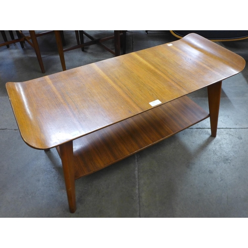 163 - A teak sleigh top coffee table