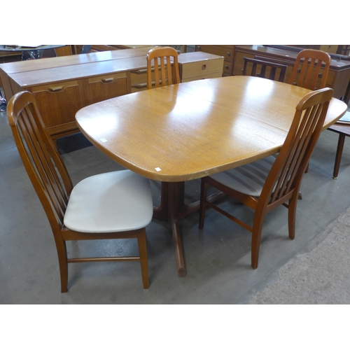 165 - A Danish Gudme Mobelfabrik teak extending dining table and four teak dining chairs