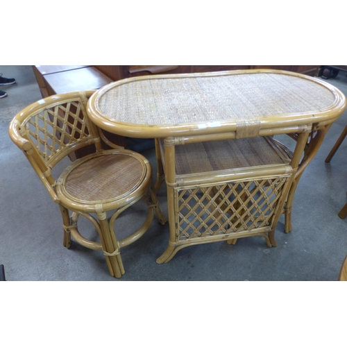 171 - A bamboo and wicker table and two chairs