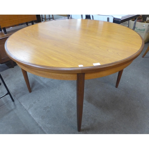 188 - A G-Plan Fresco teak circular extending dining table