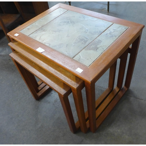 191 - A teak and tiled top nest of tables