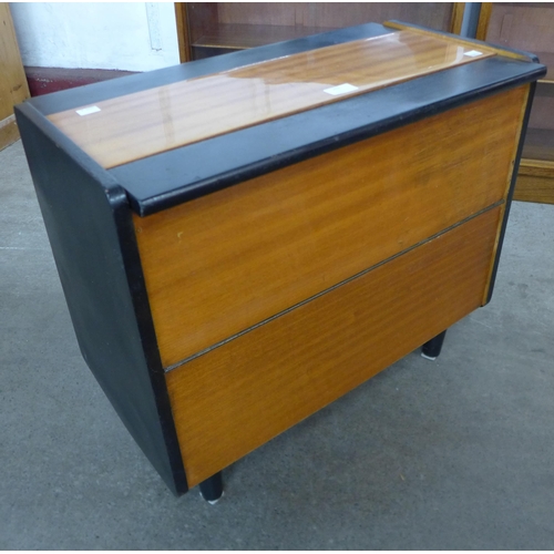 202 - A small teak and black double sided cocktail cabinet