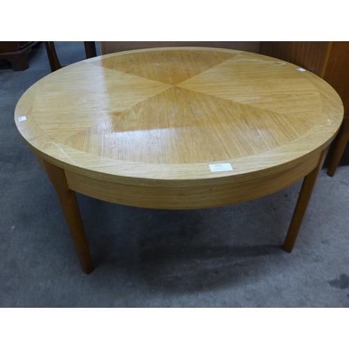 213 - A Stonehill teak circular sunburst coffee table