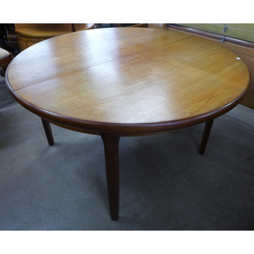 215 - A G-Plan Fresco teak circular extending dining table