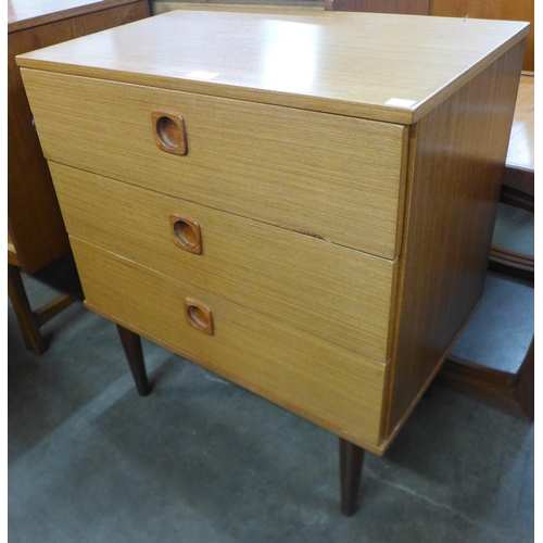 218 - A teak chest of drawers