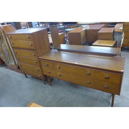 220 - A teak chest of drawers and dressing table