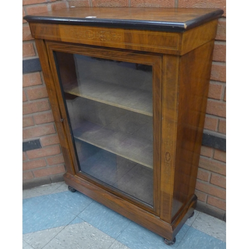 233 - A Victorian inlaid walnut pier cabinet