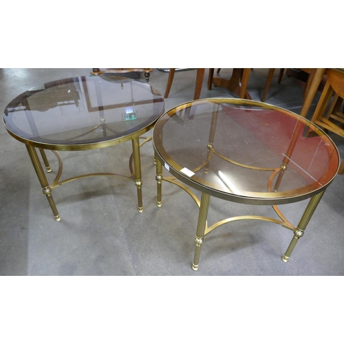 252 - A pair of Hollywood brass and glass topped circular coffee tables