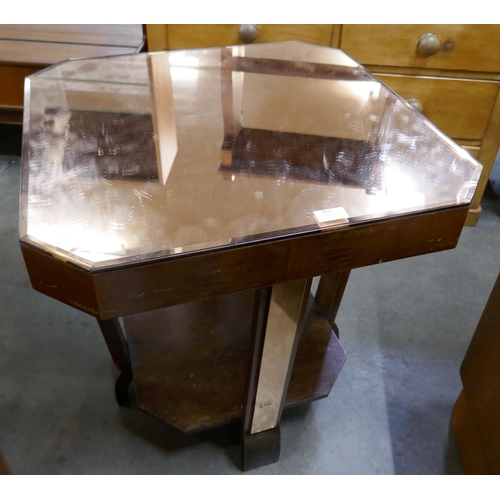 253 - An Art Deco peach mirrored glass coffee table