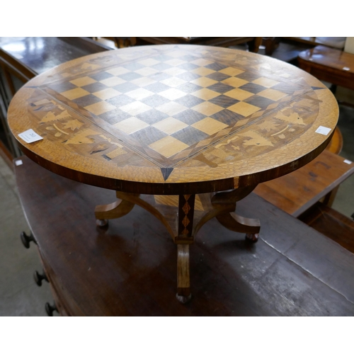 263 - A Victorian style inlaid walnut circular games table