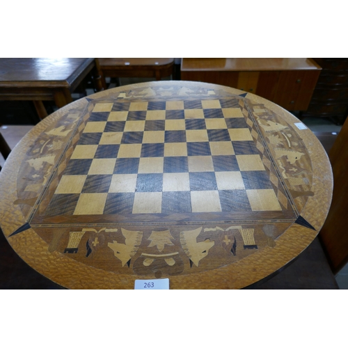 263 - A Victorian style inlaid walnut circular games table