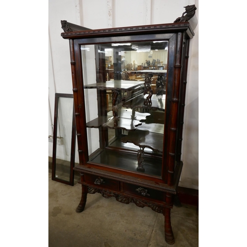 278 - A Chinese carved hardwood side cabinet