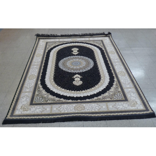 284 - An Iranian grey ground rug, 313cm x 201cm