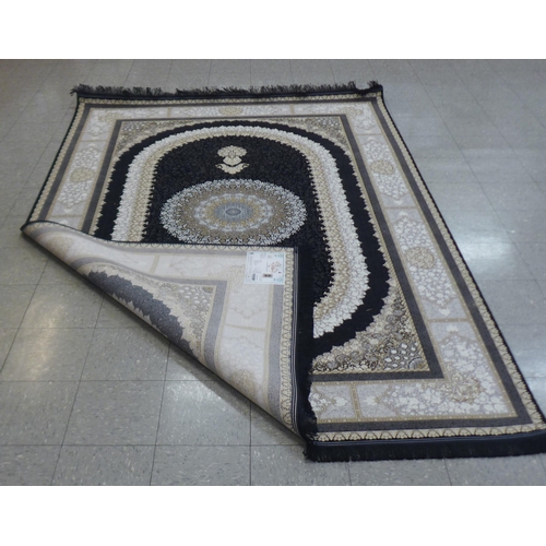 284 - An Iranian grey ground rug, 313cm x 201cm