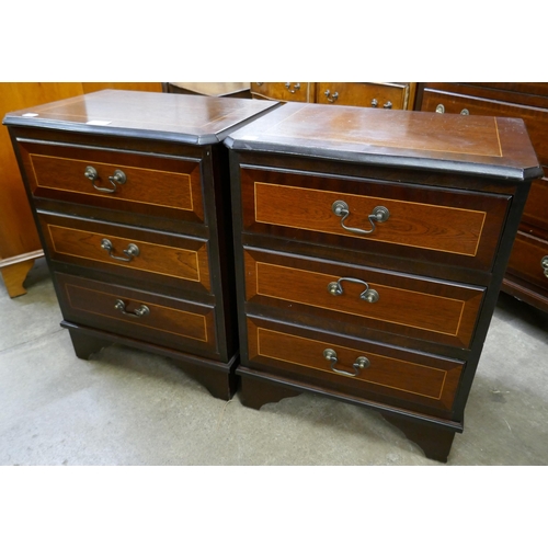 294 - A pair of small inlaid mahogany chests of drawers