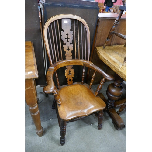 299 - A 19th Century elm and yew wood highback Windsor chair