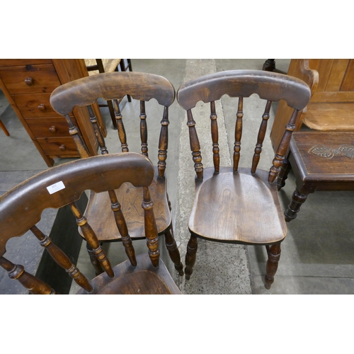 302 - A set of three Victorian elm and beech kitchen chairs