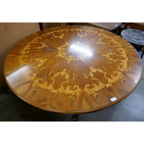 303 - A Victorian style marquetry inlaid walnut circular centre table