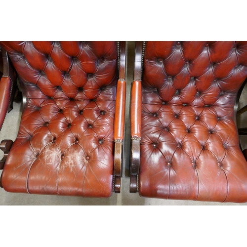 308 - A pair of Regency style mahogany and red leather armchairs