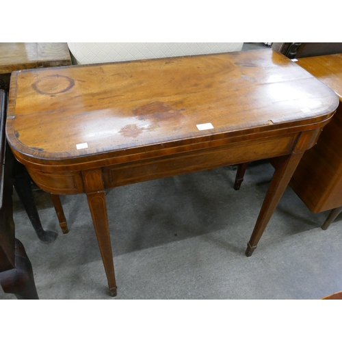 322 - A George III inlaid mahogany D-shaped card table