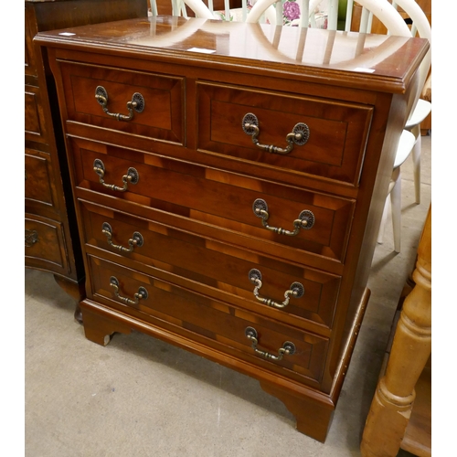 324 - A small inlaid yew wood chest of drawers