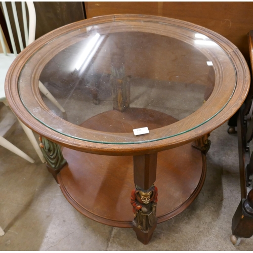 329 - A French oak and glass topped circular two tier coffee table