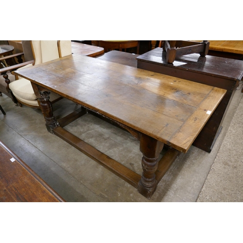 334 - A 17th Century style oak refectory table