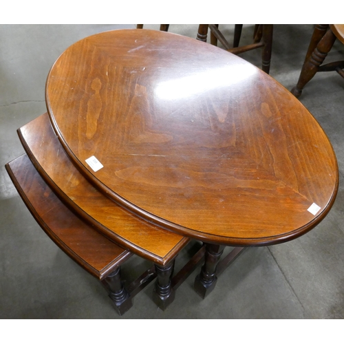 339 - An oak drop-leaf occasional table and a beech oval nest of tables