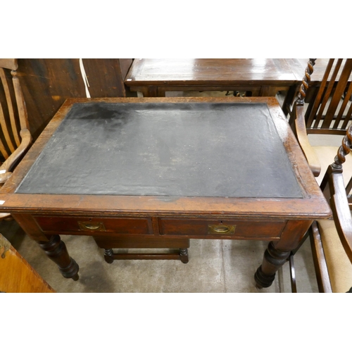 341 - A Victorian pitch pine two drawer writing table