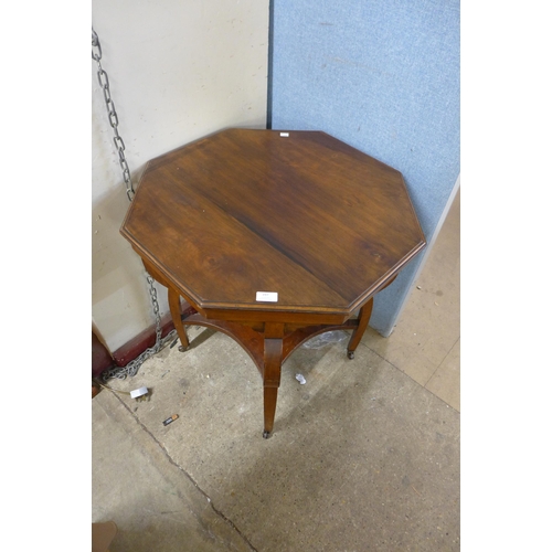 397 - A Victorian walnut octagonal table and a child's beech bentwood chair