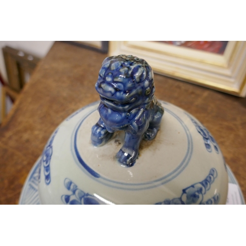 407 - A pair of large Chinese blue and white octagonal stoneware vases and covers