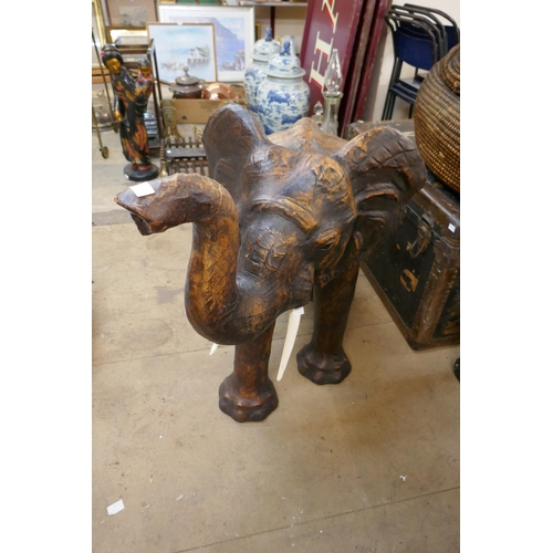 420 - A large leather figure of a baby elephant