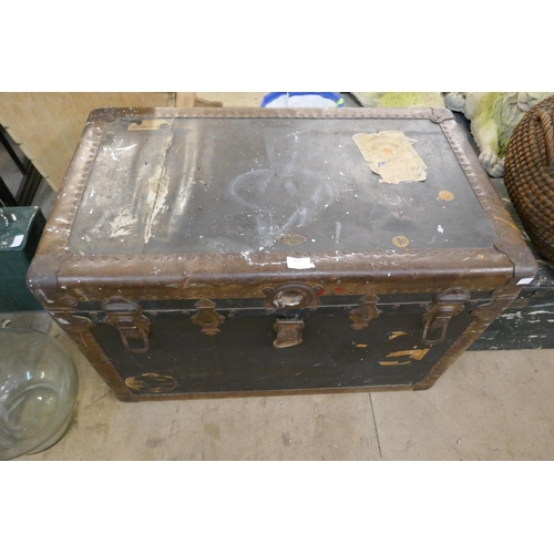 421 - A wicker lidded basket and two trunks