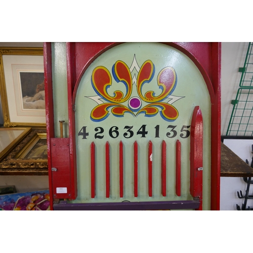 431 - A 1950s painted fairground/carnival wooden bagatelle style table top game