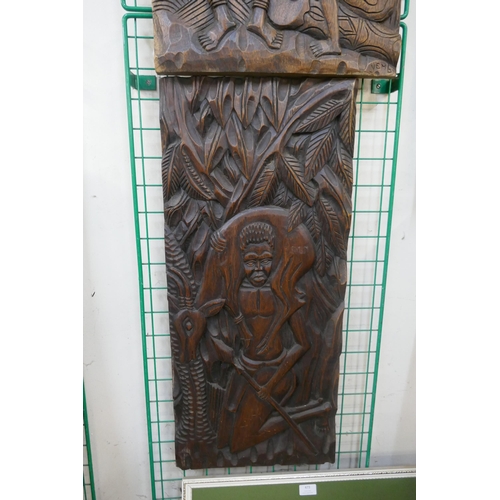 439 - Two African carved wooden plaques