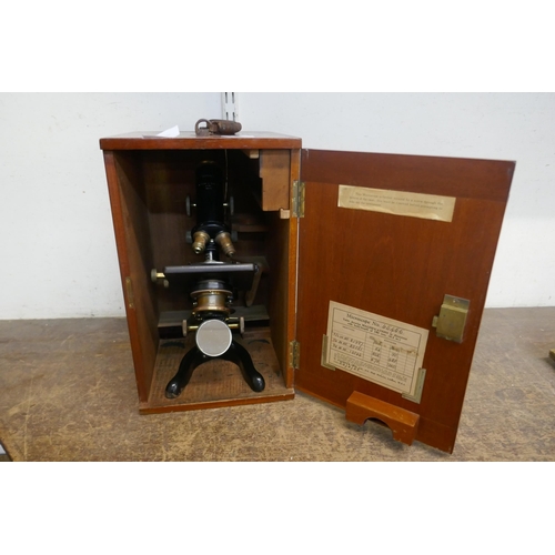 450 - A vintage cased microscope with slides, W. Watson & Sons Ltd., London