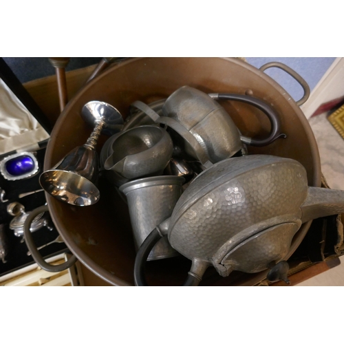 453 - A box of mixed metalwares, a copper shallow two handled pan, two funnels, a hammered pewter tea serv... 