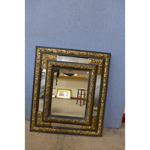 480 - A pair of Victorian ebonised and parcel gilt cushion framed mirrors