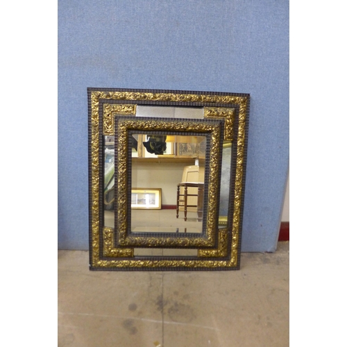 480 - A pair of Victorian ebonised and parcel gilt cushion framed mirrors