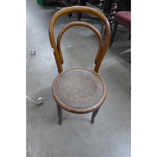 397 - A Victorian walnut octagonal table and a child's beech bentwood chair