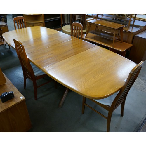 165 - A Danish Gudme Mobelfabrik teak extending dining table and four teak dining chairs