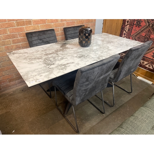 1303 - A Kos extending dining table and four Aryan dark grey velvet chairs * this lot is subject to VAT