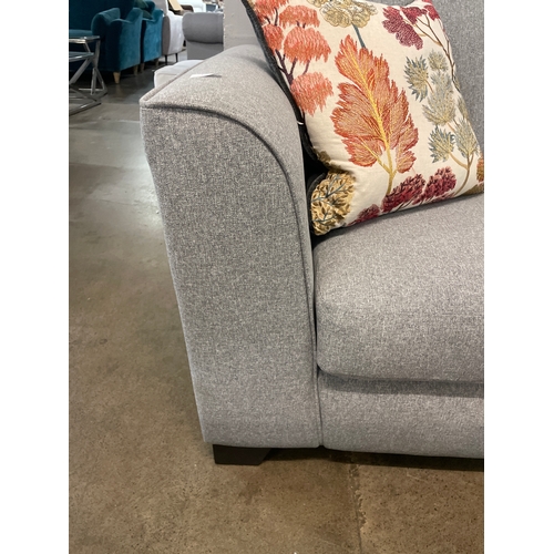 1318 - A mid grey fabric upholstered 2.5 seater sofa