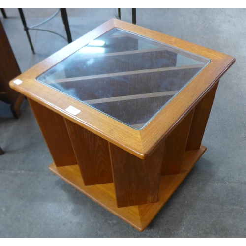 50 - A teak and glass topped coffee table/magazine rack